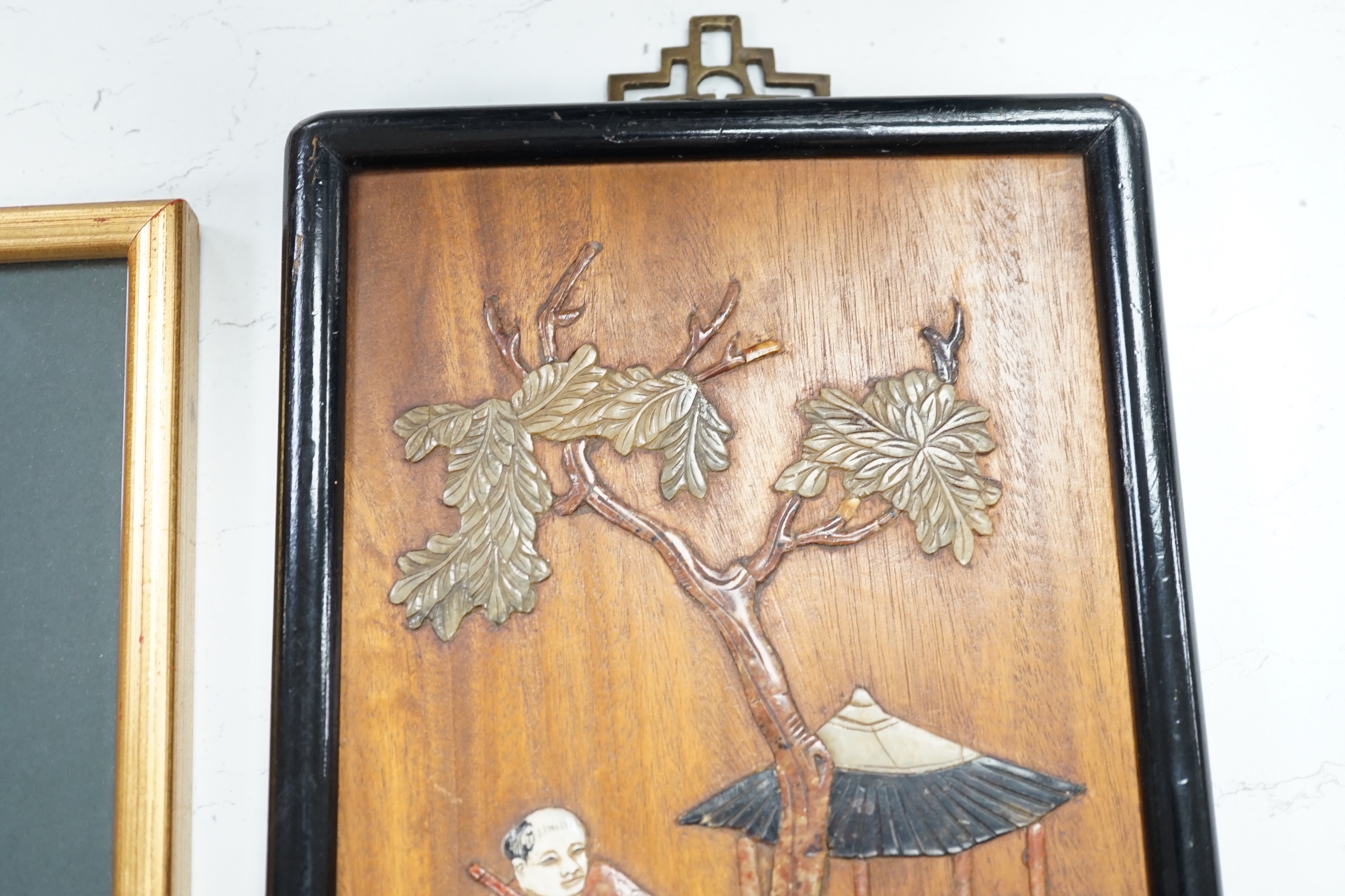 Two Chinese hardwood and mixed soapstone panels and a silk embroidered panel, largest 14.5cm x 29.5cm high